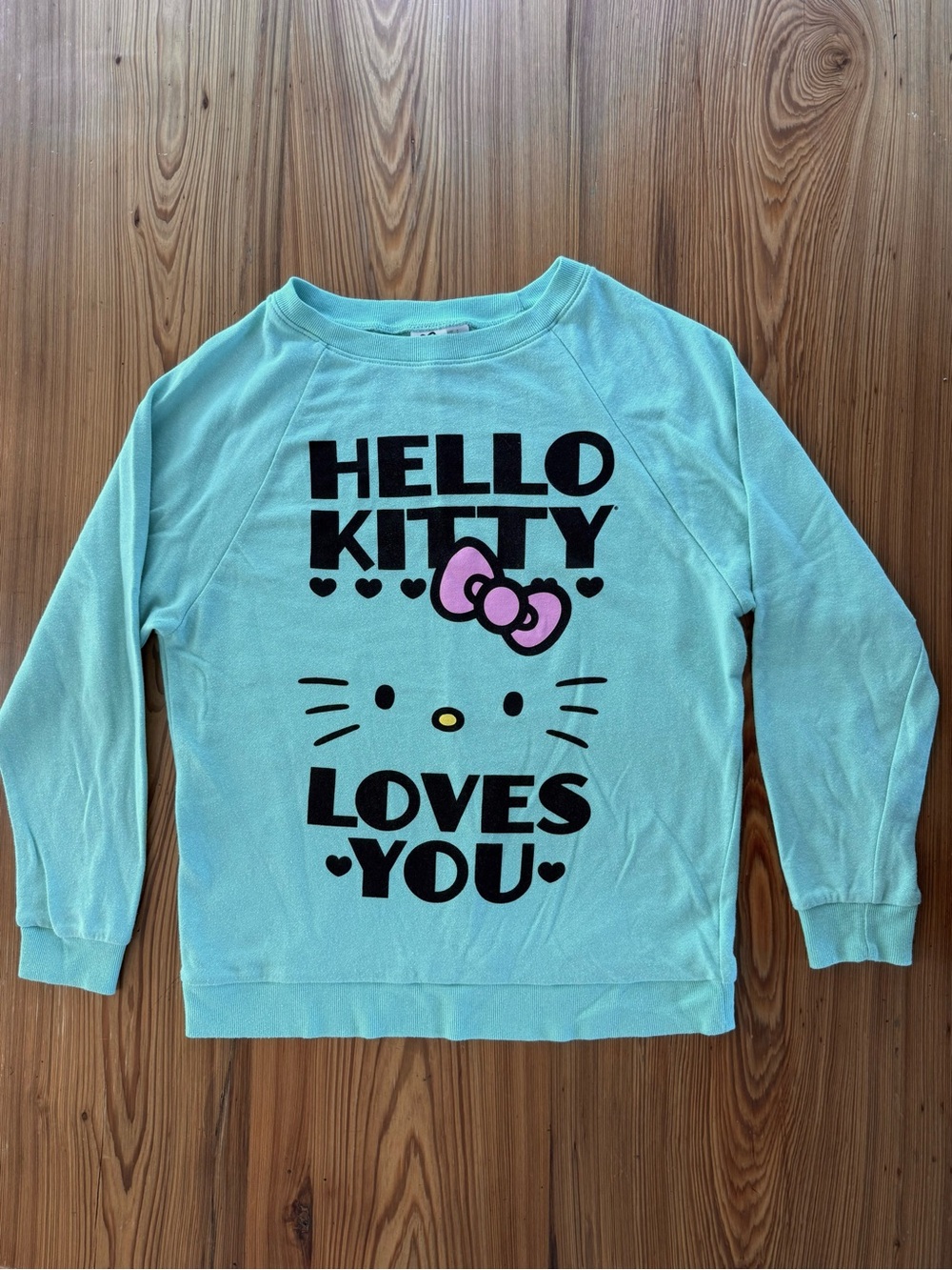 Sanrio Hello Kitty Mint Green Sweatshirt with Pink Bow Graphic